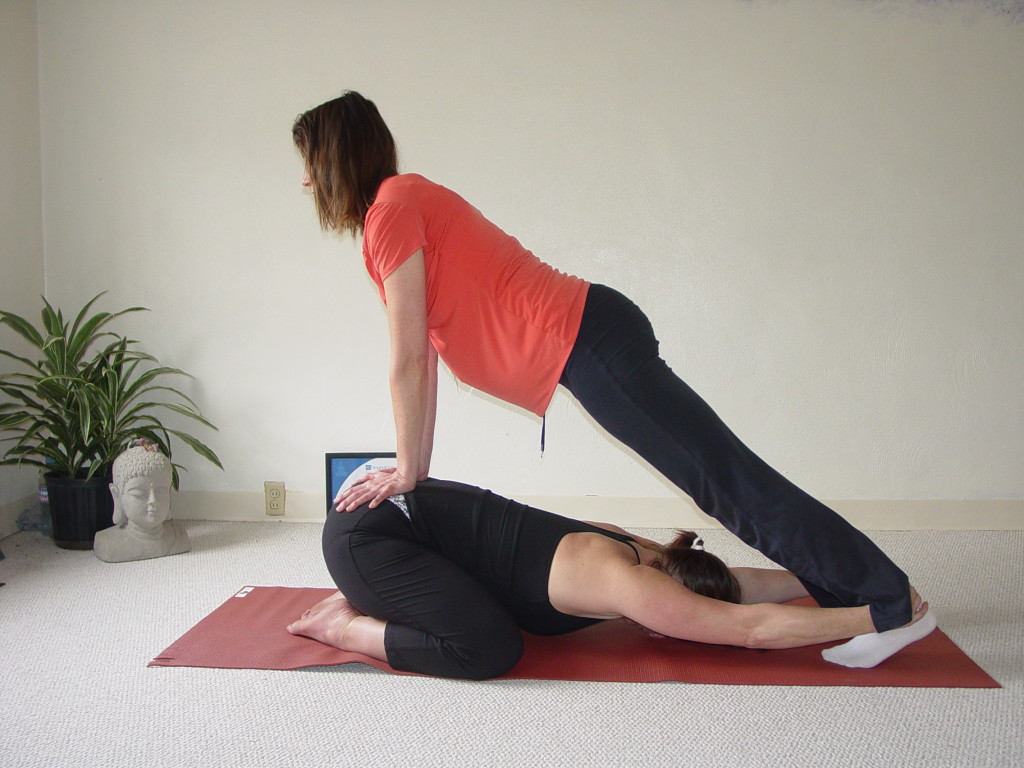 With one person in child pose reaching for the partners ankles and the other partner in plank pressing down on their sacrum with all their body weight, both benefit from a really nice stretch!