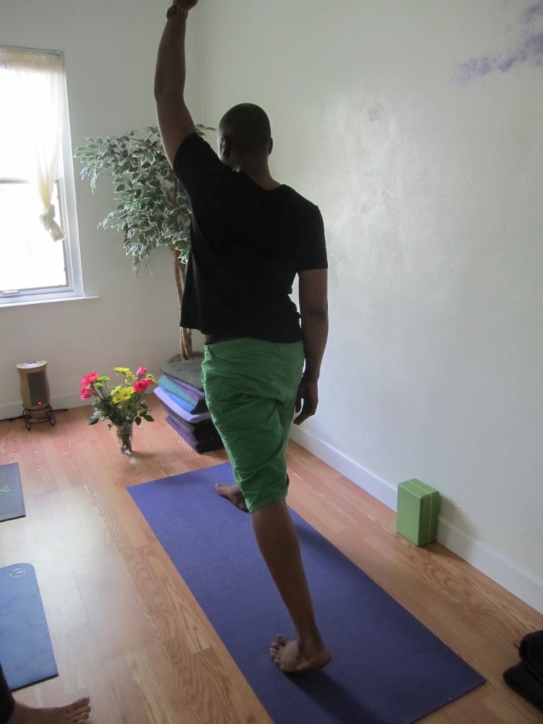 Please Note: The next set of postures to practice involves a strong internal rotation of the hips. It is best to practice these type of poses only after you have opening with external rotation. The most important step in this entire sequence of postures is the first one! It is imperative to lift up the back heel and square off the hips BEFORE leaning forward. Most misalignment occurs because students are not taught properly how to access the hips and neutralize the lower back. This results in a torque of the lower back and lack of support. Bring the same side arm above the head while paying attention and pulling the opposite hip back. Only by working to open both sides of the pelvis, can the hips adequately "square off" and the spine to lengthen.