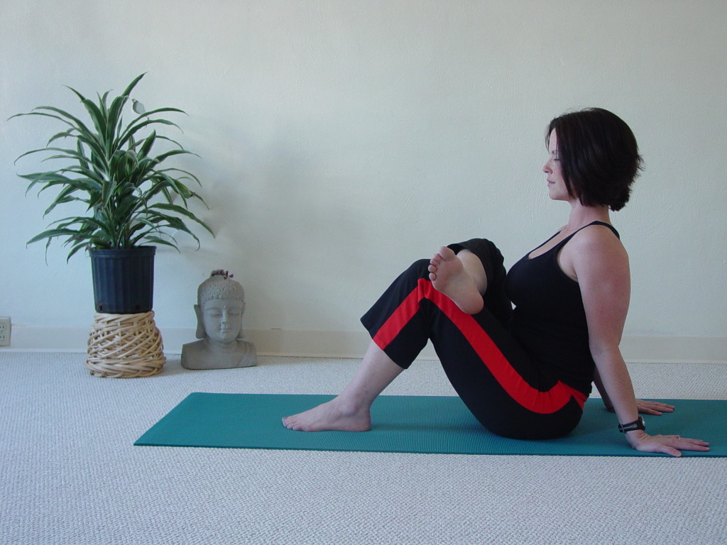 For individuals who have difficulty with the classic seated hip opener forward fold, Pigeon, ask them to take this posture, the seated pigeon posture with one ankle crossing the opposite thigh.  For a deeper stretch, ask your student to take the foot farther down the thigh toward the hip!  Seated postures are very difficult because our hips are placed in a fixed position. It is therefore, advised with beginner students or classes, to have your students open their hips in standing postures first!