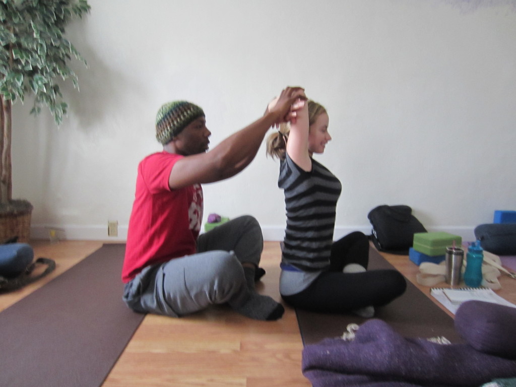 Shoulder Lift Assist From seated position, lift both arms above the head and reach for opposite elbow. Have your partner reach for your elbows and gently pull them up and back slightly. Keep your rib cage soft and down!  Breath.