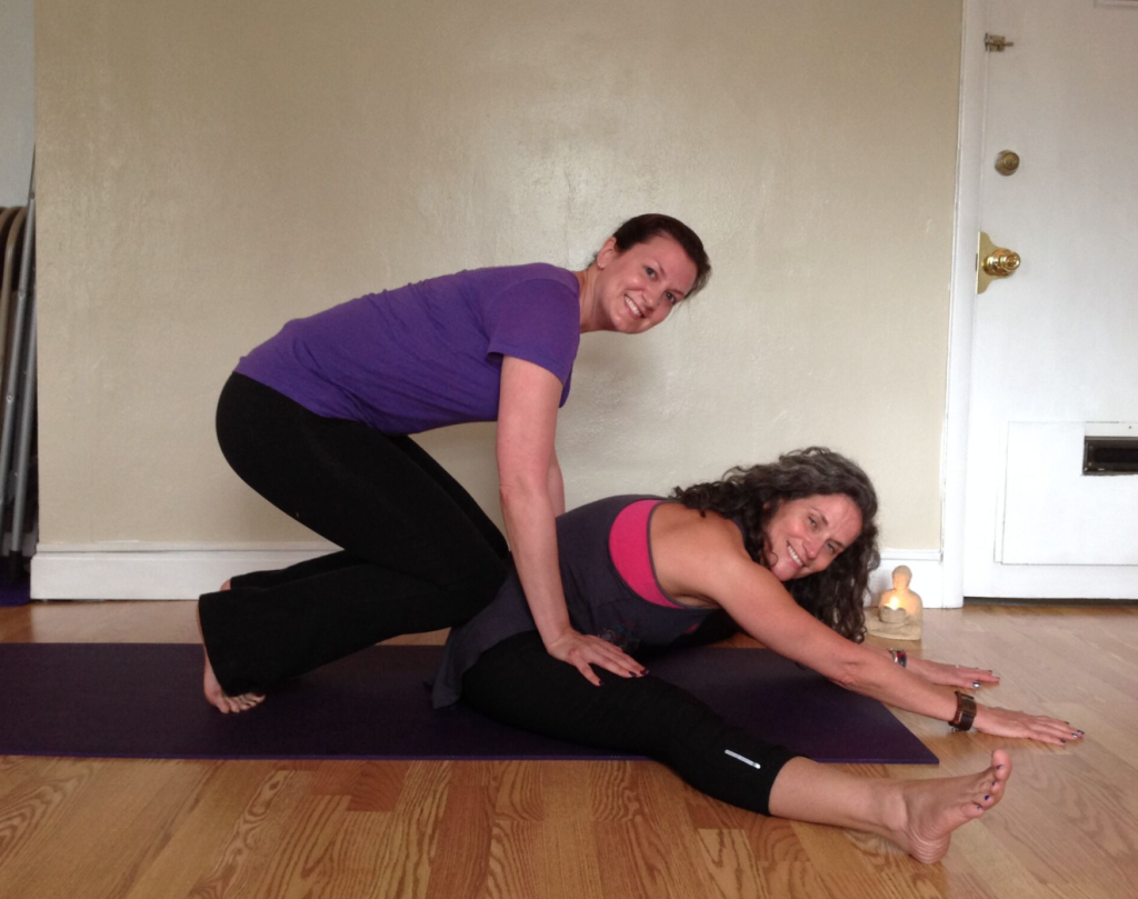 Partner Forward Fold Amanda is placing her knees on Margeau's lower rib cage and hands directly down on the quadriceps! This facilitates a active forward bend that feels soothing and restorative to the body and mind. When receiving this pose, keep the knees micro bent, and the feet fully flexed and active. Enjoy!